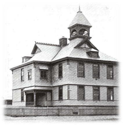 A large building with a clock tower on top of it.