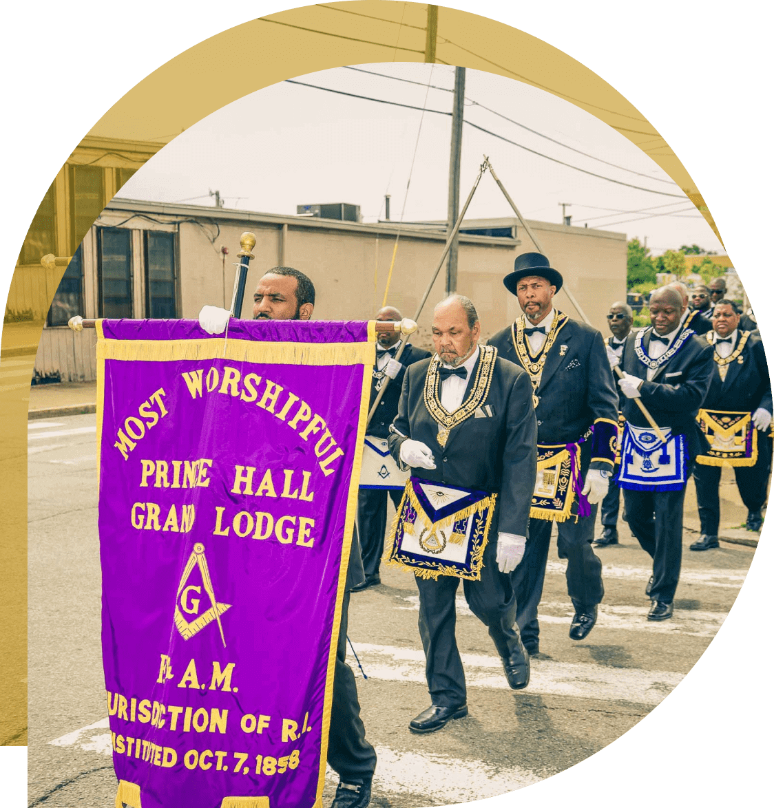 A group of men in suits and hats marching down the street.